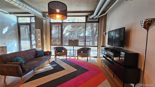 interior space with hardwood / wood-style floors and expansive windows