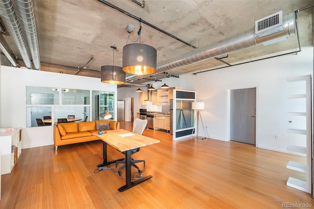 1401 Wewatta St # 101And # 102, Adjoined Denver, CO 80202 - living area featuring light wood-style flooring and baseboards