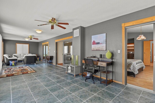 living room featuring ceiling fan