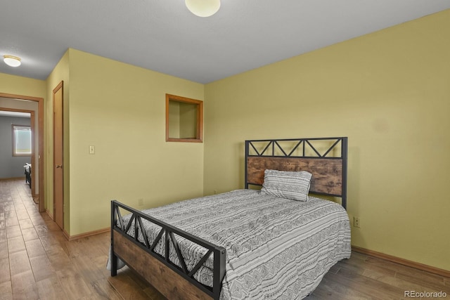 bedroom with hardwood / wood-style floors