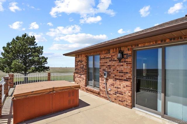 view of patio / terrace featuring a hot tub