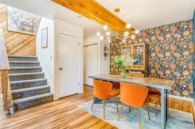 1152 S Yosemite Way Unit 29, Denver, CO 80247 - dining room with light wood-type flooring, stairs, a chandelier, and wallpapered walls
