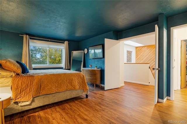 1152 S Yosemite Way Unit 29, Denver, CO 80247 - bedroom featuring wood finished floors and baseboards