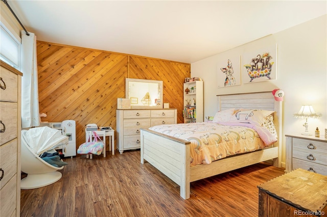 1152 S Yosemite Way Unit 29, Denver, CO 80247 - bedroom with dark wood-type flooring and wooden walls