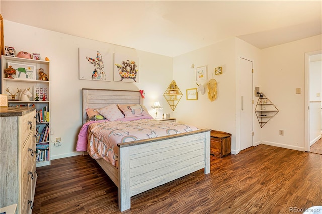 1152 S Yosemite Way Unit 29, Denver, CO 80247 - bedroom with wood finished floors and baseboards