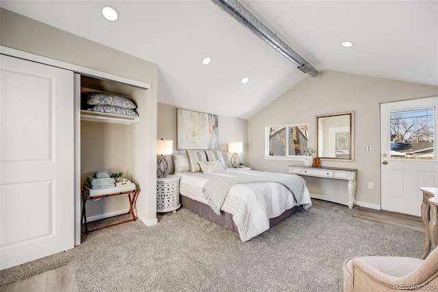 carpeted bedroom featuring lofted ceiling with beams