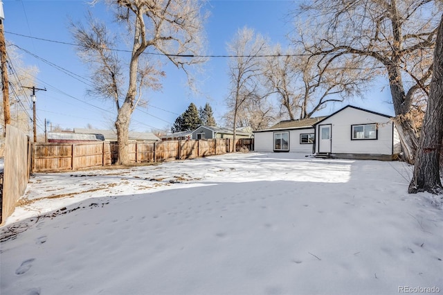 view of yard covered in snow