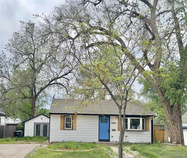 4745 S Sherman St, Englewood, CO 80113 - view of front of home with fence and roof with shingles