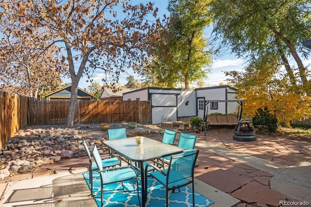 view of patio featuring a storage shed