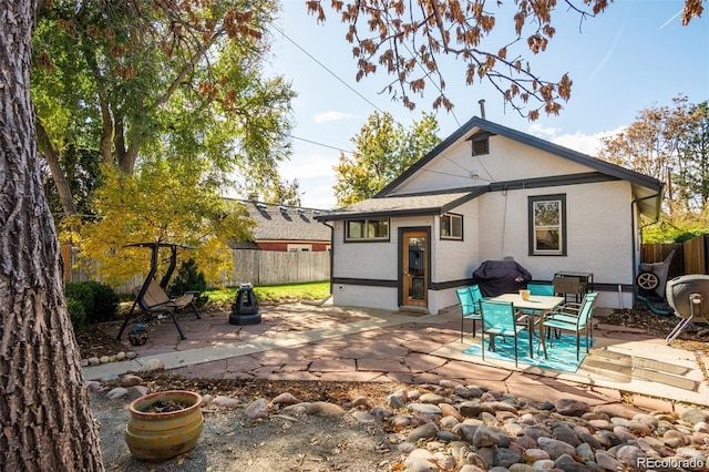 back of property featuring a patio area