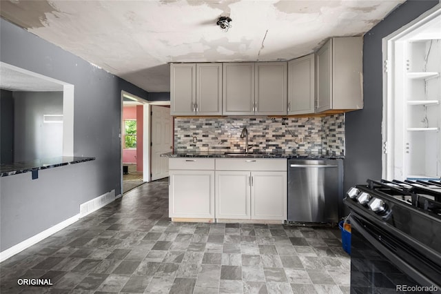 5481 Leyden St, Commerce City, CO 80022 - kitchen featuring gray cabinetry, black gas stove, decorative backsplash, and stainless steel dishwasher