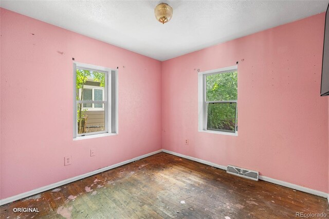 5481 Leyden St, Commerce City, CO 80022 - spare room with hardwood / wood-style flooring and baseboards