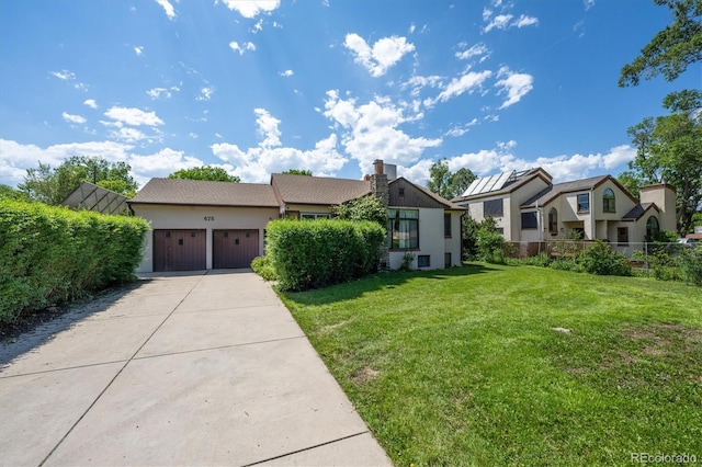 675 Holland St, Lakewood, CO 80215 - view of front facade with an attached garage, concrete driveway, stucco siding, and a residential view