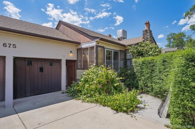675 Holland St, Lakewood, CO 80215 - property entrance with stucco siding