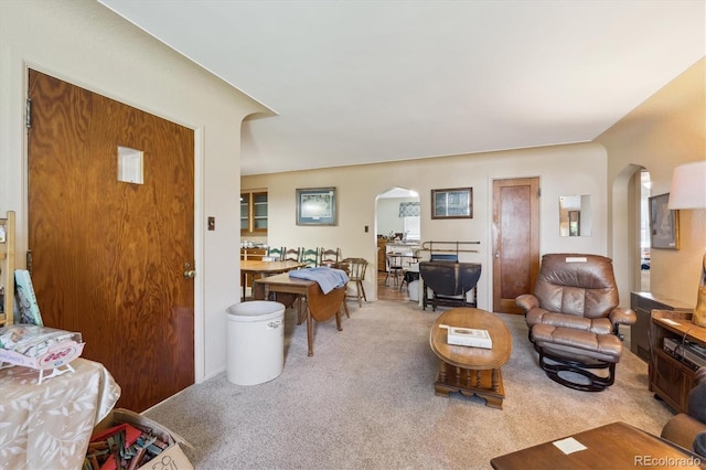 675 Holland St, Lakewood, CO 80215 - carpeted living room featuring arched walkways