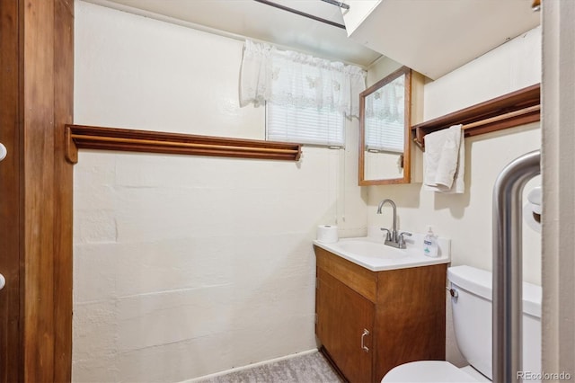 675 Holland St, Lakewood, CO 80215 - bathroom with vanity and toilet
