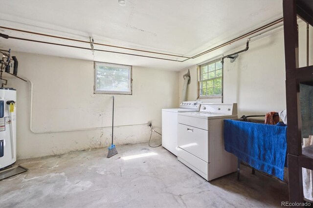 675 Holland St, Lakewood, CO 80215 - washroom featuring washer and clothes dryer and water heater