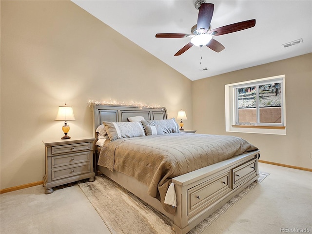 bedroom with lofted ceiling, baseboards, visible vents, and light carpet