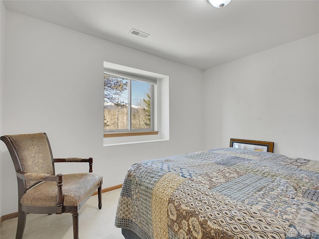 bedroom with visible vents, baseboards, and carpet floors