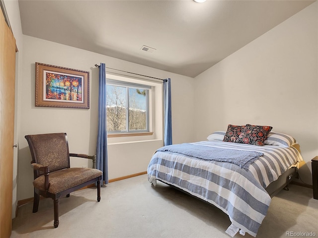 bedroom featuring light colored carpet, visible vents, and baseboards