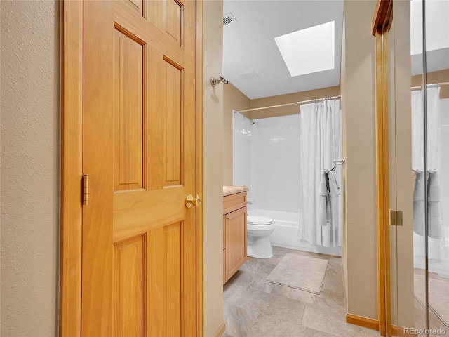 full bath with visible vents, shower / bath combo with shower curtain, toilet, a skylight, and vanity