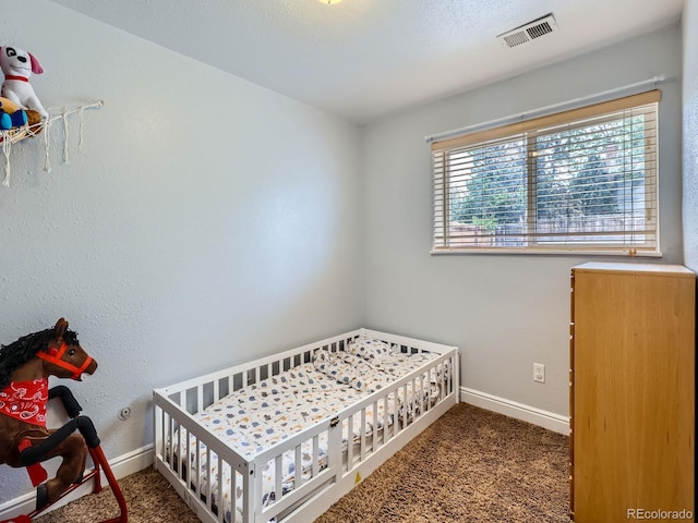 380 S 25th Ave, Brighton, CO 80601 - bedroom featuring carpet floors, baseboards, and a crib
