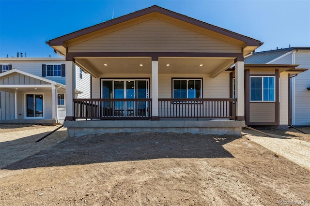 back of property featuring a porch