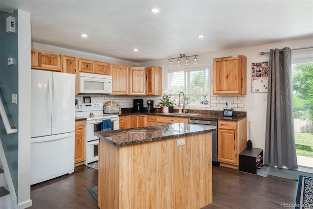 12296 Birch St, Thornton, CO 80241 - kitchen with white appliances, tasteful backsplash, dark wood finished floors, and recessed lighting