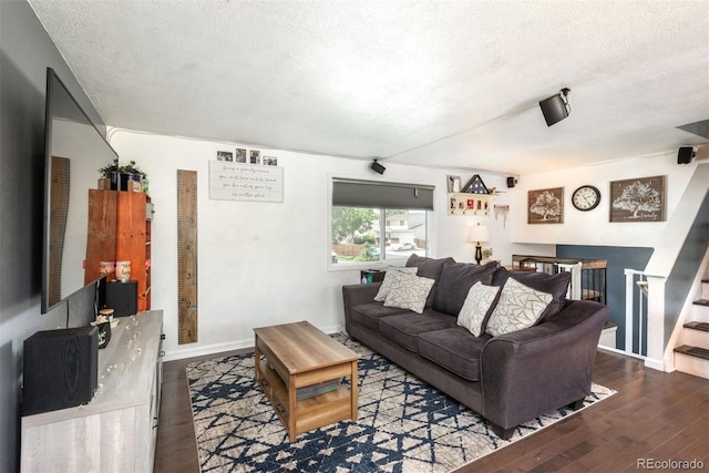 12296 Birch St, Thornton, CO 80241 - living area featuring a textured ceiling and wood finished floors