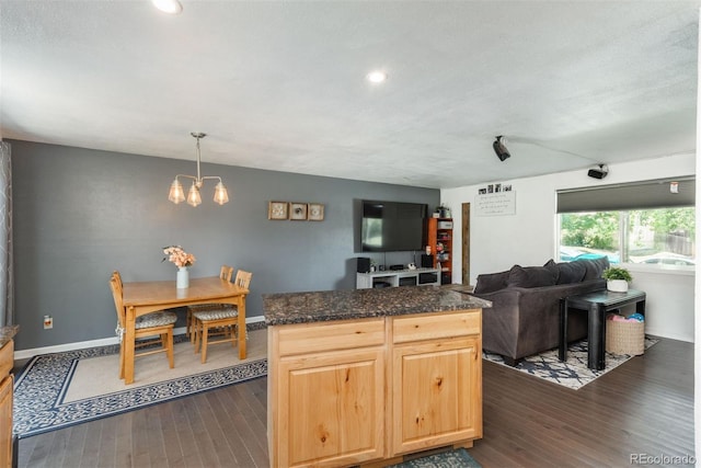 12296 Birch St, Thornton, CO 80241 - kitchen featuring dark wood finished floors, a chandelier, recessed lighting, open floor plan, and a center island