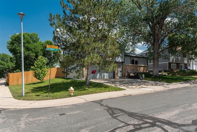 12296 Birch St, Thornton, CO 80241 - obstructed view of property with concrete driveway and a garage