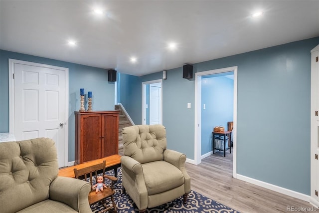 12296 Birch St, Thornton, CO 80241 - living room featuring stairs, light wood-type flooring, and recessed lighting