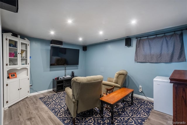 12296 Birch St, Thornton, CO 80241 - home theater featuring light wood-type flooring and recessed lighting