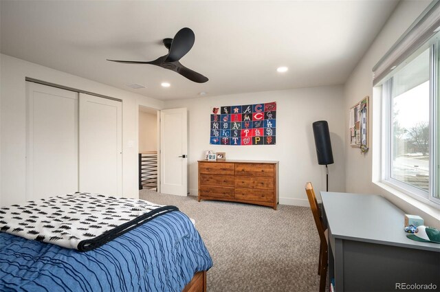 carpeted bedroom with ceiling fan, baseboards, a closet, and recessed lighting