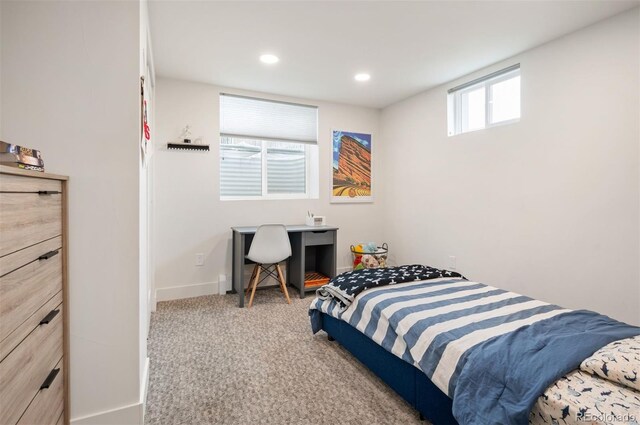 carpeted bedroom featuring recessed lighting and baseboards