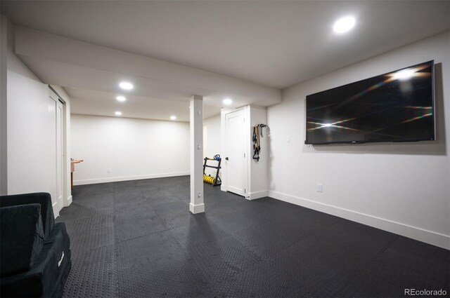 finished basement with recessed lighting, baseboards, and a dark floor