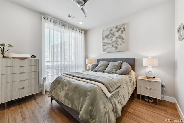 bedroom featuring hardwood / wood-style flooring and ceiling fan