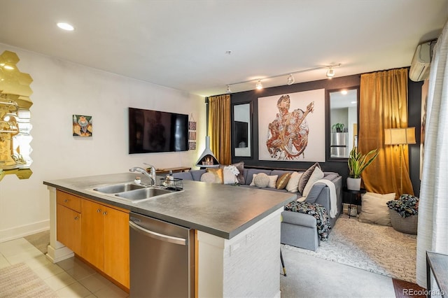 801 Confidence Dr Unit 2, Longmont, CO 80504 - kitchen featuring stainless steel dishwasher, open floor plan, a wall mounted AC, and a kitchen island with sink
