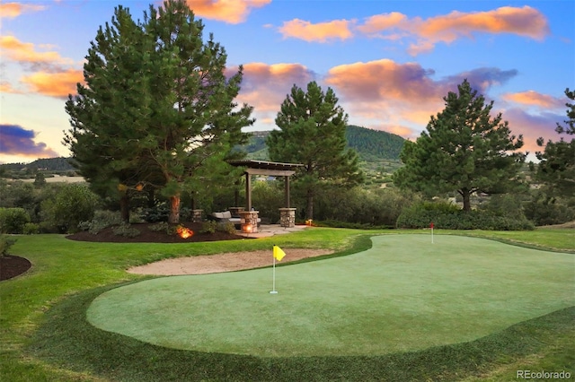 view of property's community featuring a pergola and a mountain view