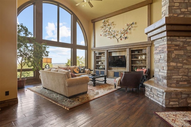 living room with high vaulted ceiling and a wealth of natural light