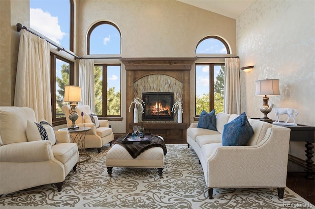 living area featuring plenty of natural light and high vaulted ceiling