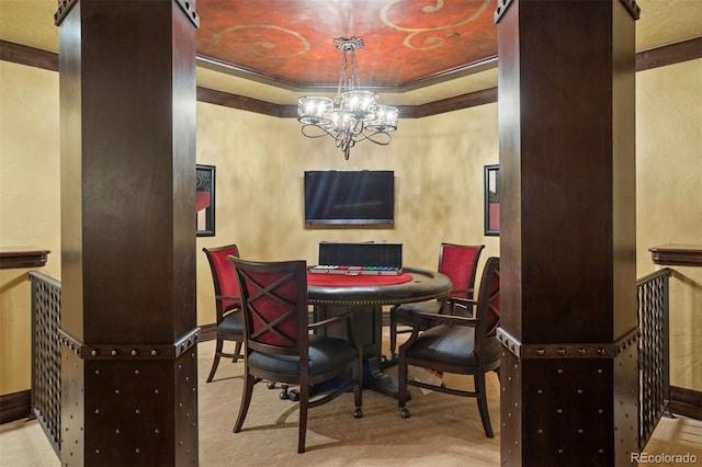 dining space with ornamental molding and a chandelier