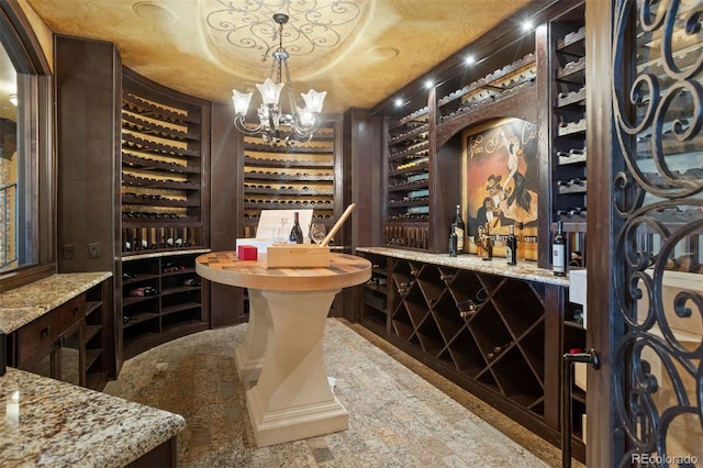 wine area featuring an inviting chandelier