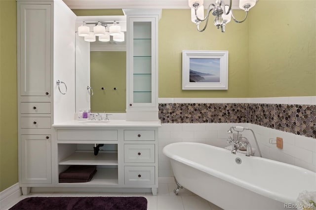 bathroom featuring a bathing tub, tile patterned floors, a chandelier, vanity, and tile walls