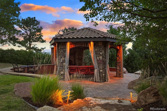 view of property's community with a gazebo and a patio area