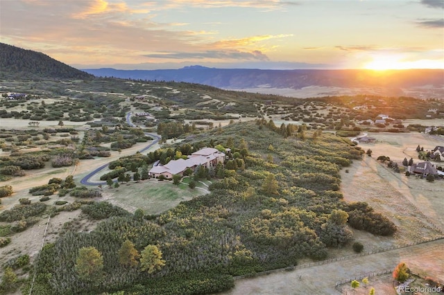 aerial view at dusk with a mountain view