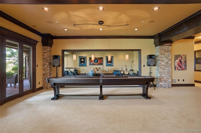 recreation room featuring decorative columns, pool table, light colored carpet, and ornamental molding