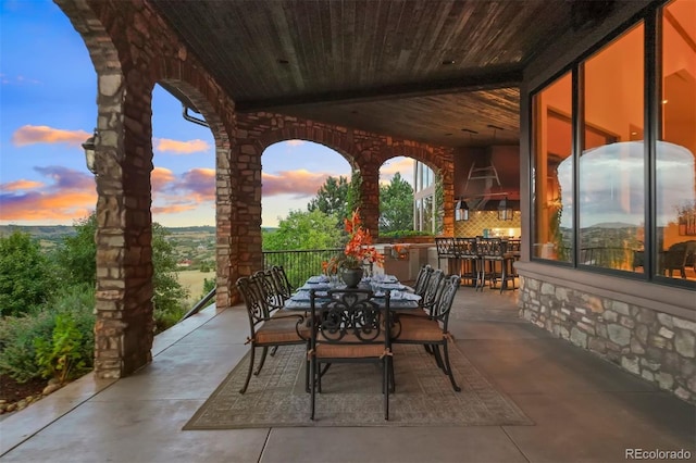 patio terrace at dusk with a bar