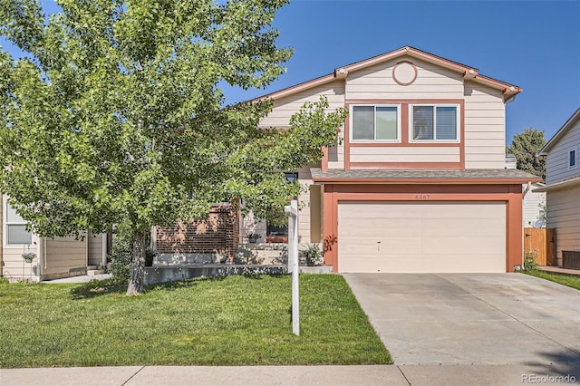 6367 Xavier St, Arvada, CO 80003 - view of front of property with an attached garage, a front lawn, driveway, and central AC unit