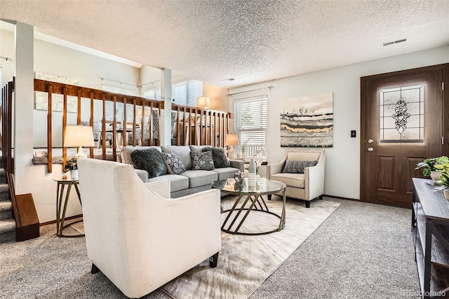 6367 Xavier St, Arvada, CO 80003 - living room with light colored carpet, a textured ceiling, and baseboards